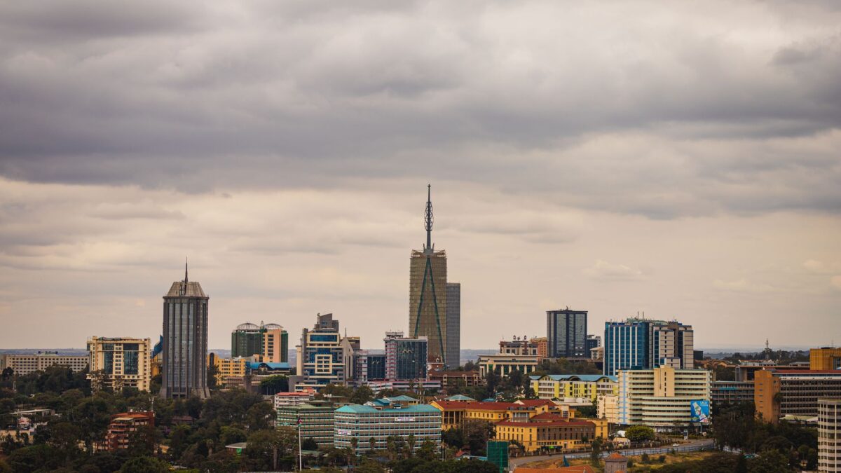 Explore the vibrant skyline of Nairobi with its modern skyscrapers under an overcast sky.