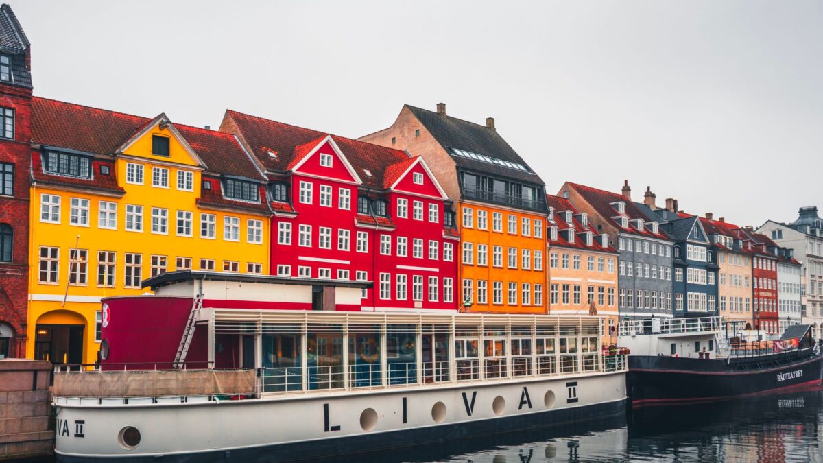 Vibrant houses along Nyhavn Canal in Copenhagen, showcasing iconic Danish architecture.