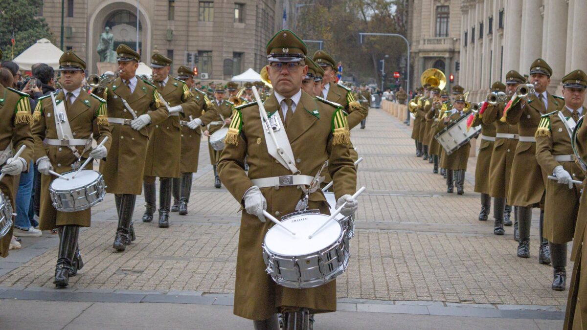 Chilean military band marching in a ceremonial parade near La Moneda Palace, Santiago.