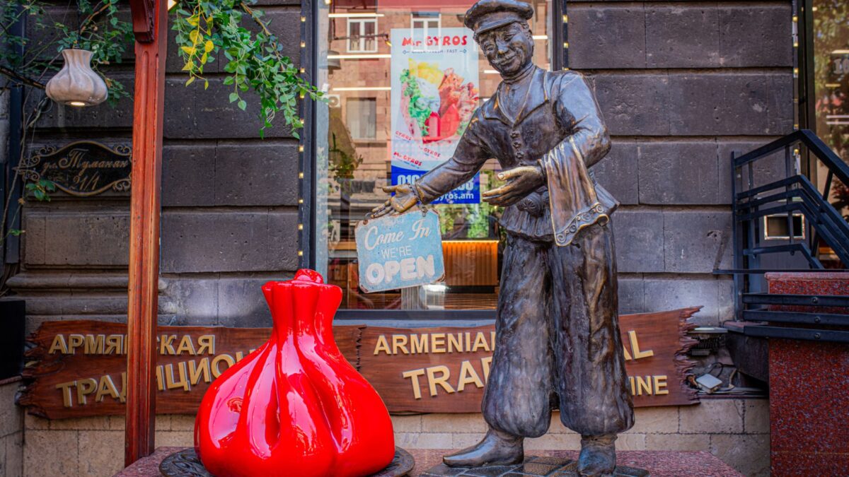 A decorative statue welcoming visitors at the entrance of an Armenian traditional restaurant.