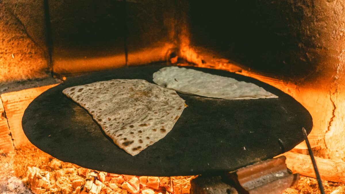 Authentic Turkish flatbread baking in a traditional wood-fired oven.