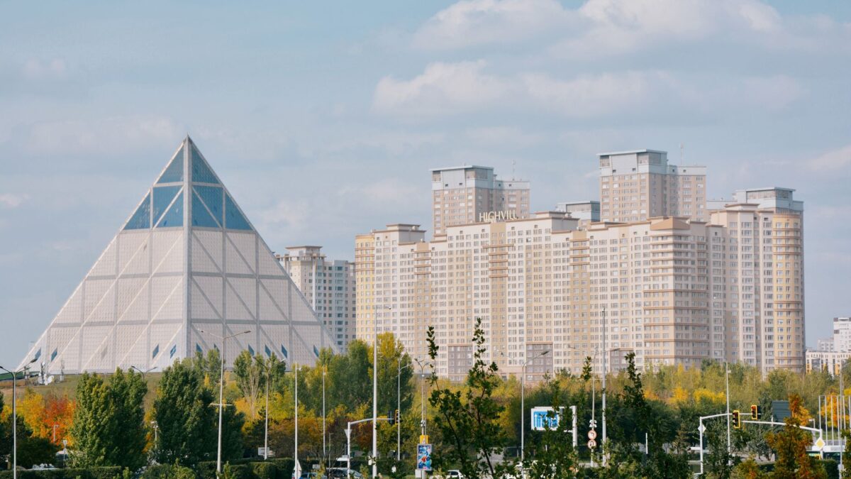 The Pyramid of Peace and Harmony and urban skyline in Astana, Kazakhstan.