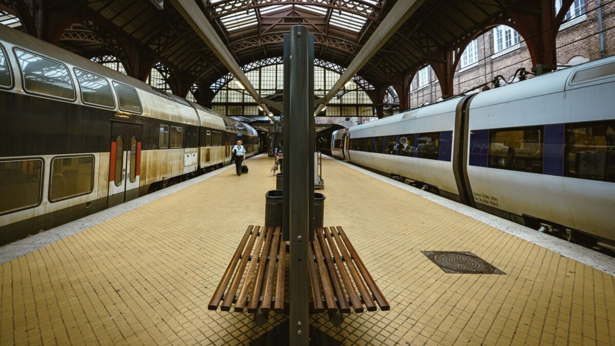 View of platforms at Copenhagen's central railway station with trains on both sides.