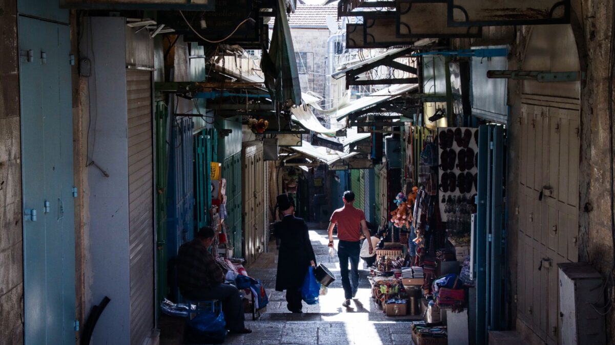 A bustling alley filled with shops in the Old City of Jerusalem, Israel.