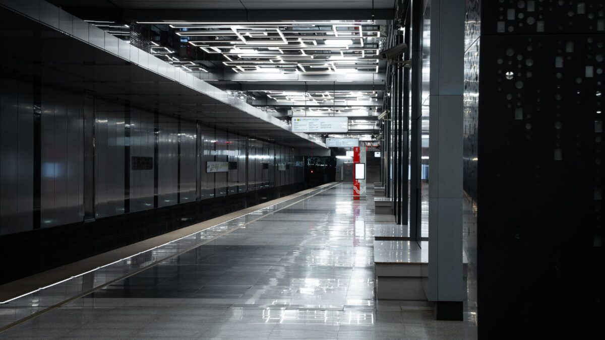 Sleek and modern subway station in Moscow, showcasing reflective surfaces and urban architecture.