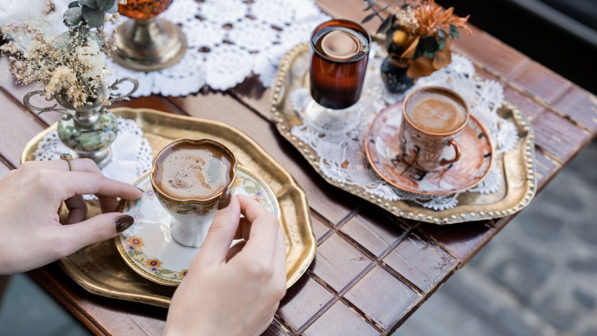 Enjoying Turkish coffee served in ornate cups on an autumn day in Istanbul.