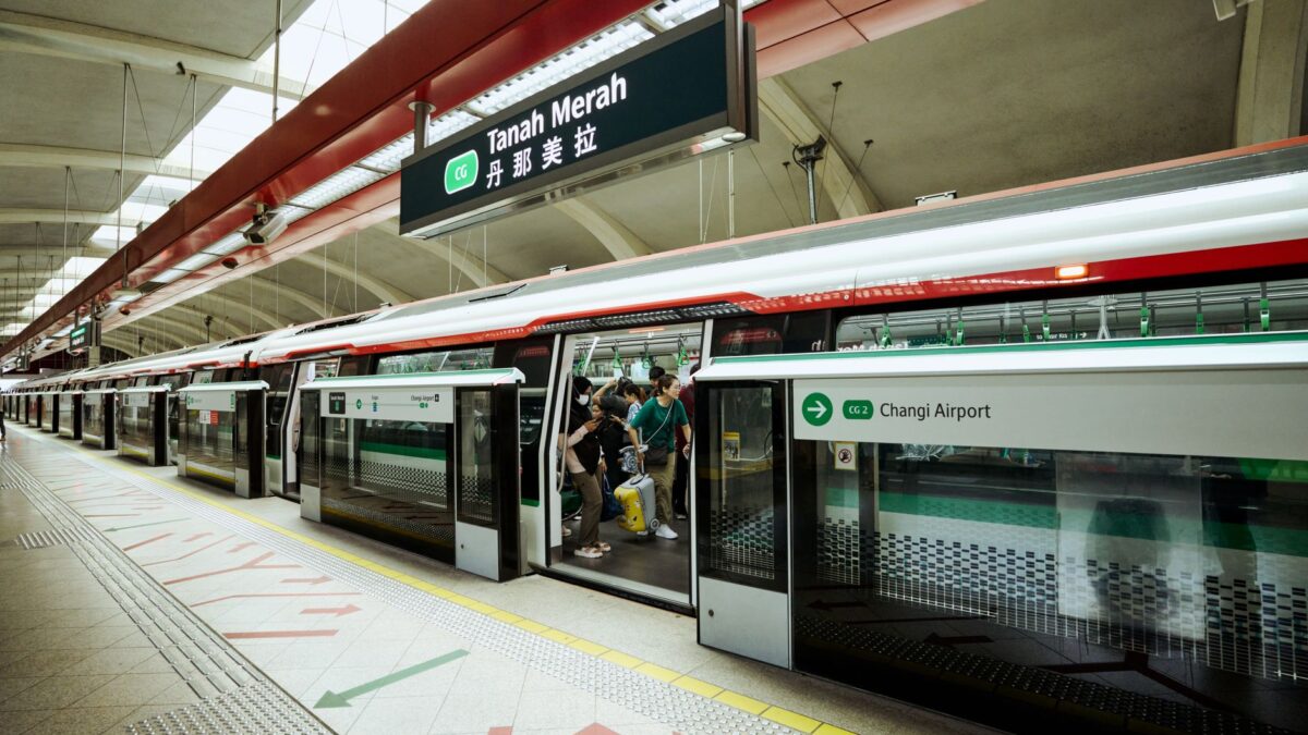 Commuters boarding at Tanah Merah MRT Station in Singapore's efficient metro system.