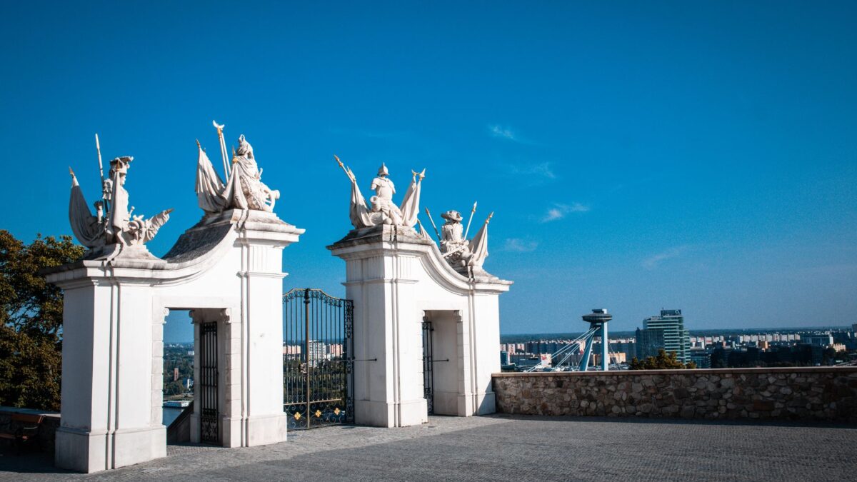 Scenic view of Bratislava with an elegant castle gate, capturing a blend of history and modernity.