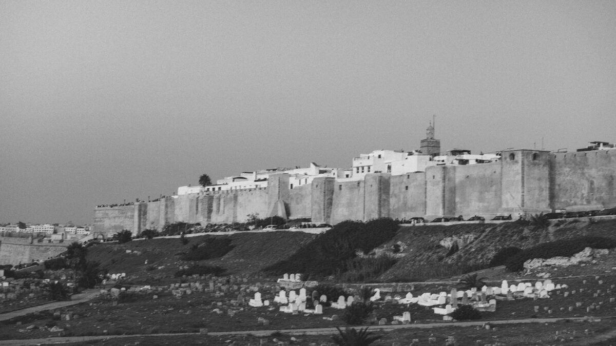 Black and white view of Rabat's ancient walls and cemetery. A historical glimpse of Morocco.